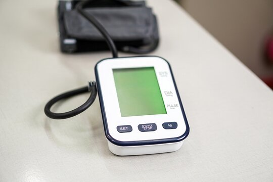 Digital Blood Pressure Monitor on Office Desk for Health Check