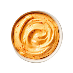 Fototapeta premium A bowl of yellow sauce with red pepper flakes