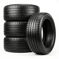 Stack of Black Car Tires with Tread Pattern on White Background