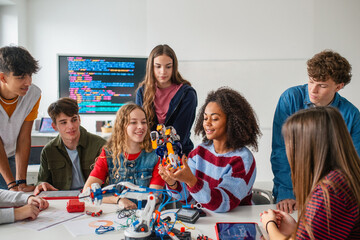 Fototapeta na wymiar Diverse group of students working on engineering school project.
