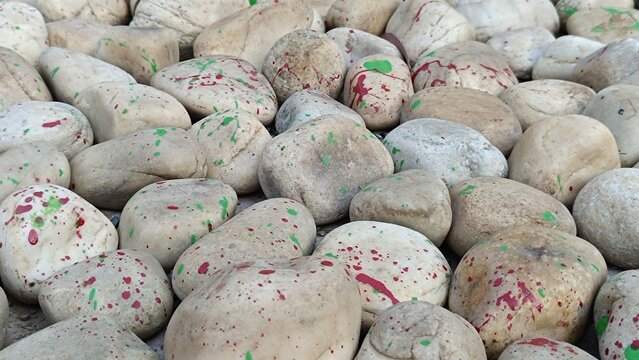 Texture of large smooth stones decoratively laid out on the ground