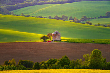 Fototapeta premium Gorgeous rural landscape with green sunny spring hills. South Moravia region, Czech Republic