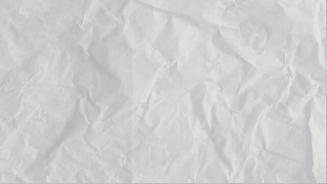 Crumpled and crinkled white paper texture stop motion animation background