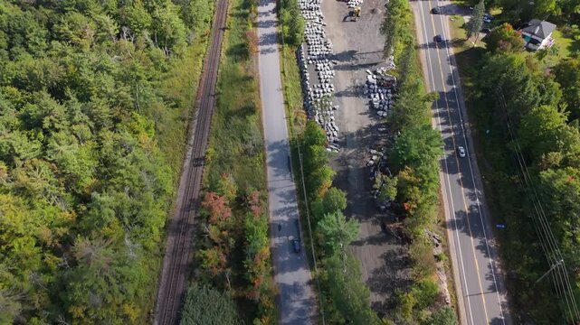Aerial Tracking Cars and stone supply yards for stone cottages and mansions in Gravenhurst, Muskoka, Ontario, Canada