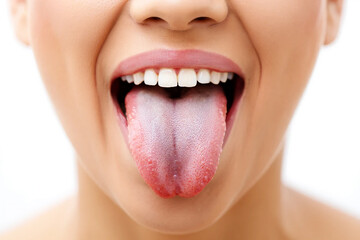 Close up of a woman's open mouth with her tongue sticking out image