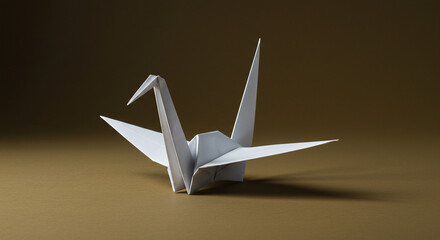 White origami crane on brown background