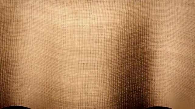 Close-up of textured burlap fabric with a subtle shadow and light gradient