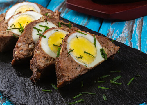Meatloaf with a chicken egg inside, baked in the oven with spices