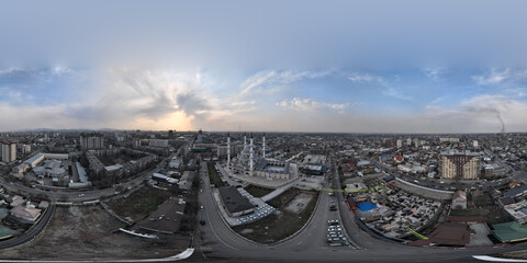 A grand 360 degree equirectangular drone view of the Imam Al-Sarakhsi Central Mosque in Bishkek. The shot captures the stunning Ottoman-style architecture, featuring four tall minarets and massive dom © Microscope