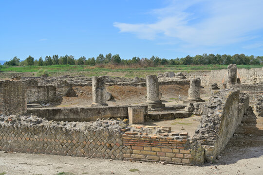 Ancient Roman ruins of Sibari archaeological site in Calabria. Historic stone ruins and columns of the ancient Roman city of Sibari under a bright sky