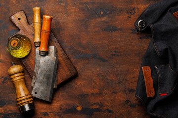 Meat cooking utensils on wooden table