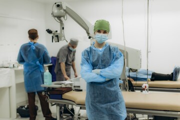 Female surgeon preparing for eye surgery in clinic