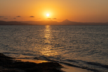 Fototapeta premium Sunset over Las Marinas beach Mediterranean sea in Denia Alicante Spain summer time