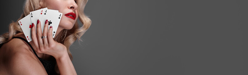 Blonde lady woman in black shiny dress and expensive diamond jewelry is winner money from Omaha...