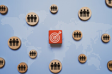 Dartboard and people icon on wooden with world map representing target customer, audience segmentation, global marketing strategy and customer relation management for support business growth.