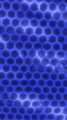 Obraz premium Futuristic glowing blue hexagonal grid forming an abstract tech-inspired pattern