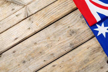 Directly above shot of australia flag on wooden table with copy space