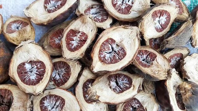 Dried areca nut slices from Indonesia, commonly used in traditional culture and trade. Natural agricultural product with economic and herbal value.