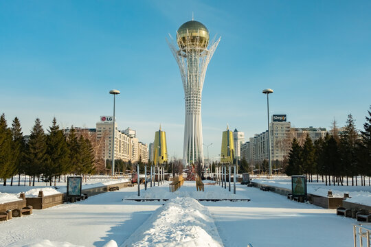 Kazakhstan's Bayterek Tower stands tall against a clear blue sky in winter, surrounded by buildings and snow-covered ground. January 30, 2026, Astana, Kazakhstan