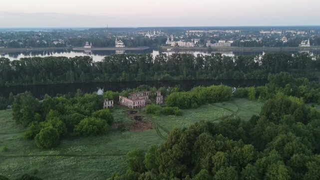 Panoramic Aerial Drone View of Volga River and Uglich Kremlin with Suponevsky Palace Ruins in Foreground. Ideal for documentary projects, historical features, travel storytelling, cultural heritage.
