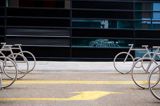 Bicycle and bikes parking at rack on urban street in Oslo Norway with modern transportation infrastructure and minimal city markings