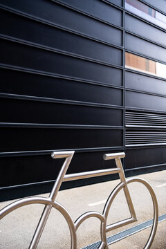 Bicycle rack parking in minimal architecture on urban street in Oslo Norway during daylight with clean modern lines and exterior design
