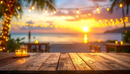 Beach scene with wooden table, candles, lights, and a stunning sunset