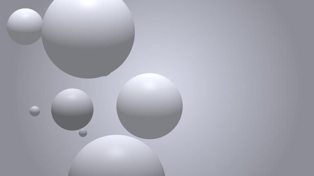Abstract floating spheres in a soft gray gradient background representing modern design and concepts.