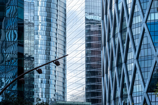 Corporate city architecture featuring modern skyline skyscraper towers and glass surfaces in Paris La Defense with urban depth