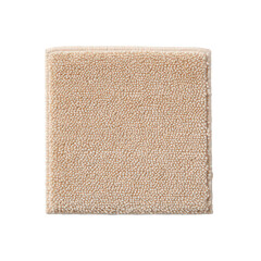 Fototapeta premium Close up of a beige carpet swatch showing its soft texture and neutral color.