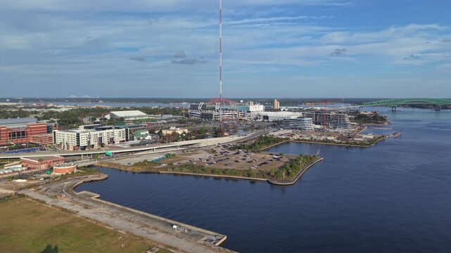 Aerial view of the TIAA Bank Field stadium, with its vibrant colors contrasting against the deep blue river, Jacksonville, Florida, United States.