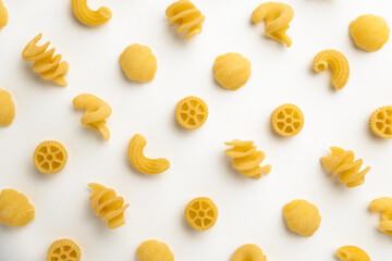 few uncooked pasta types on white background. different pasta, insalata di pasta. texture, food...