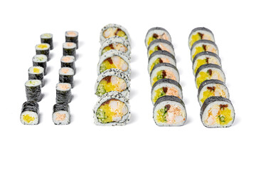 Large sushi set with Philadelphia roll, eel roll, tartare roll and hosomaki on a white background isolated for menu © Анатолій Патрашок