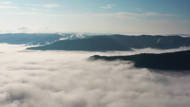 Southern Urals in summer: Southern Kraka ridge, aerial view. Morning fog in the mountains.