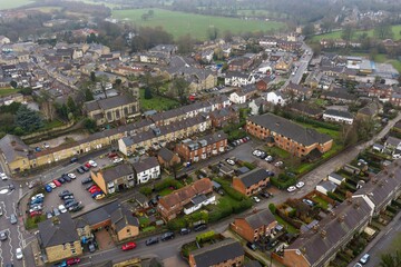 Fototapeta premium Aerial drone photo of the town of Wetherby in the City of Leeds, West Yorkshire, England showing rows of houses and streets in the neighbourhood on an overcast cold day in the winter time
