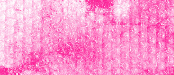 Creative bubble wrap texture &mdash; hot pink watercolor background in rose tones. Transparent plastic bubbles &mdash; abstract glamour composition for music covers, contemporary design
