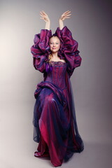 Graceful Girl in Dramatic Purple Fantasy Gown