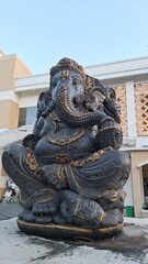 Fototapeta premium Majestic Ganesha statue with gold accents, embodying wisdom and good fortune