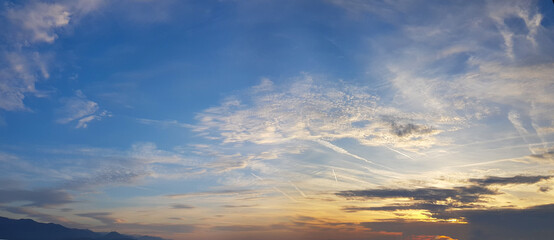 Dawn. Panoramic landscape with sun light and clouds on sky