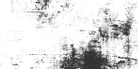 Obraz premium Grungy distressed black and white textured background with rough surface and scattered marks grunge