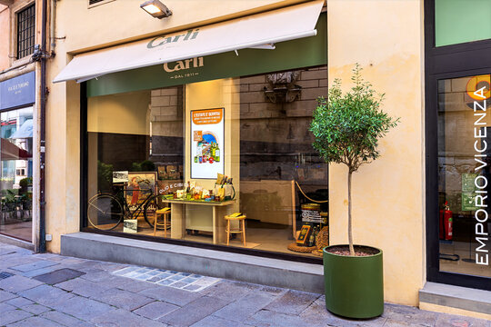 Vicenza, Italy - July 8, 2024: The facade of the Emporio Fratelli Carli store, specializing in high-quality Ligurian products including oils, pasta and sauces.
