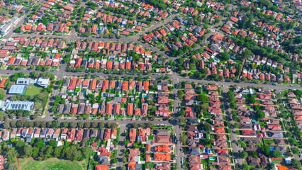 Panoramic Aerial Drone view of Inner Western Suburbs of Sydney housing, roof tops, the streets and the parks, the roads and trees of Ashbury Ashfield Burwood Summer Hill Canterbury and Campsie in Sydn