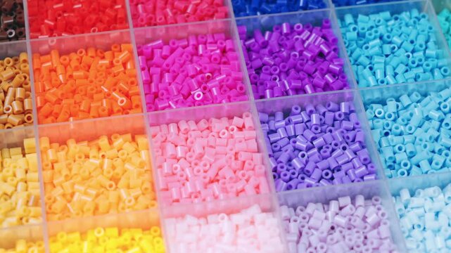 colorful plastic polymer granules on blue background