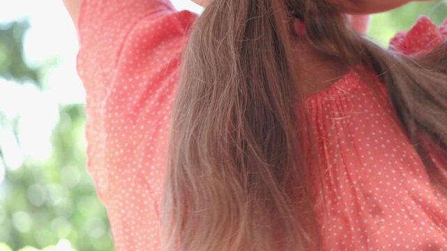 mature woman, being braided long brown hair, enjoying moment self-care, self-acceptance and journey aging with grace and dignity