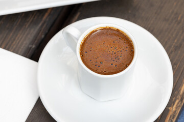 Fototapeta premium Close-Up of Turkish Coffee in White Cup