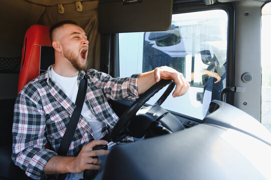 Truck driver yawning experiencing fatigue driving vehicle