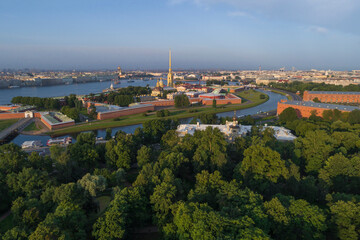 The ancient Peter and Paul Fortress in the cityscape on a sunny July morning (aerial photography). Saint Petersburg, Russia