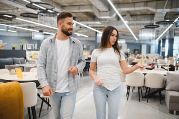 Obraz premium Couple shopping for new furniture in showroom