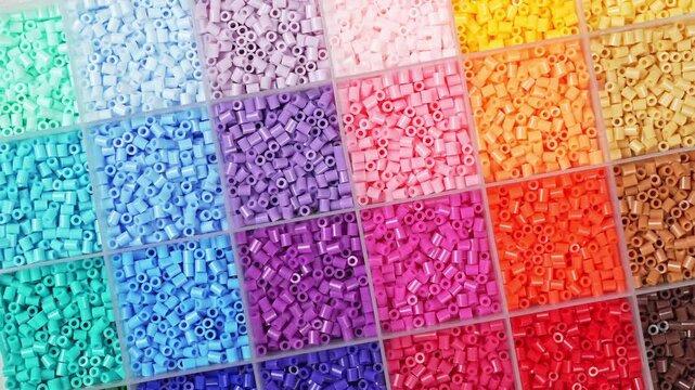 colorful plastic polymer granules on blue background