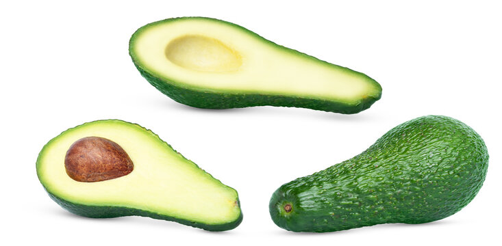Set of ripe fresh whole and halved avocados isolated. Whole avocado, cut in a half of avocado with pit and half of avocado without seed.